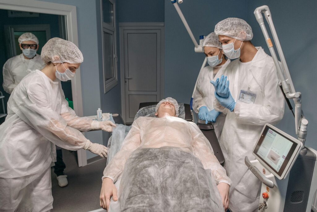 hospital workers caring for patient