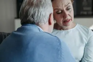 husband supporting wife in pain