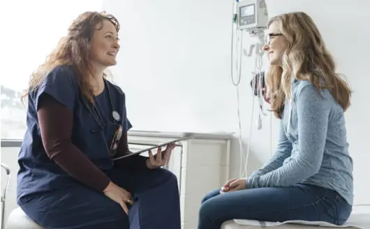 Go To Health Media | Nearly 37.5 Million Children are Covered by Medicaid and CHIP: Federal Cuts Could Hurt Female doctor with teenage girl patient